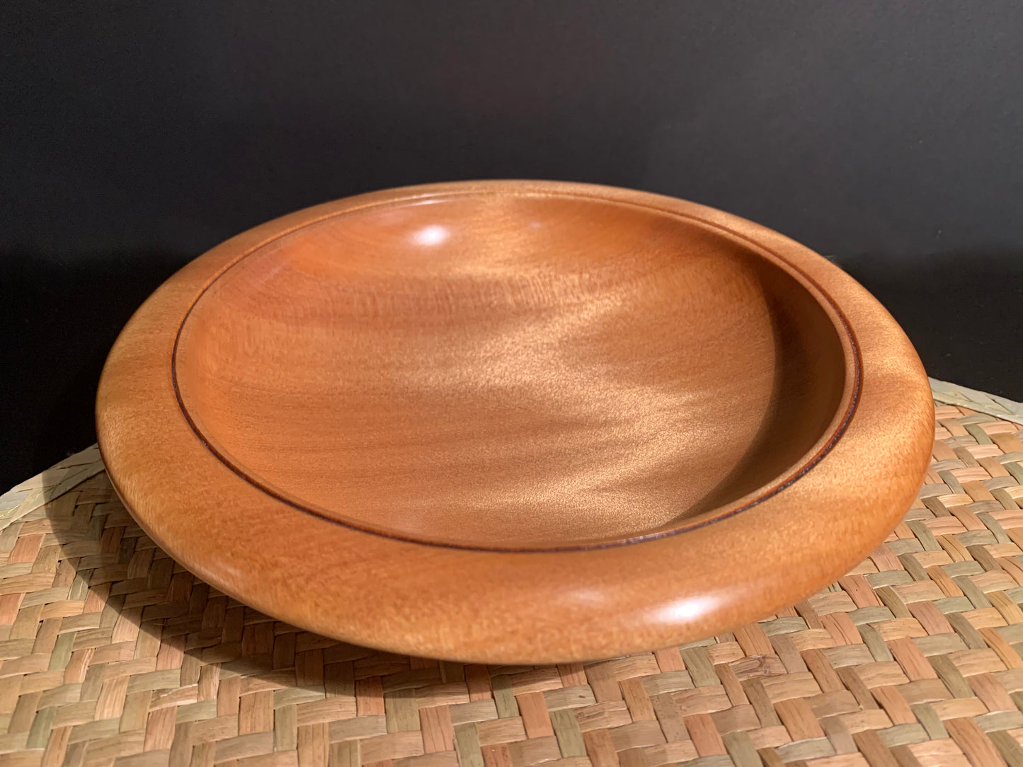 Wooden bowl with bevelled edge and a smooth oil  and wax finish. 