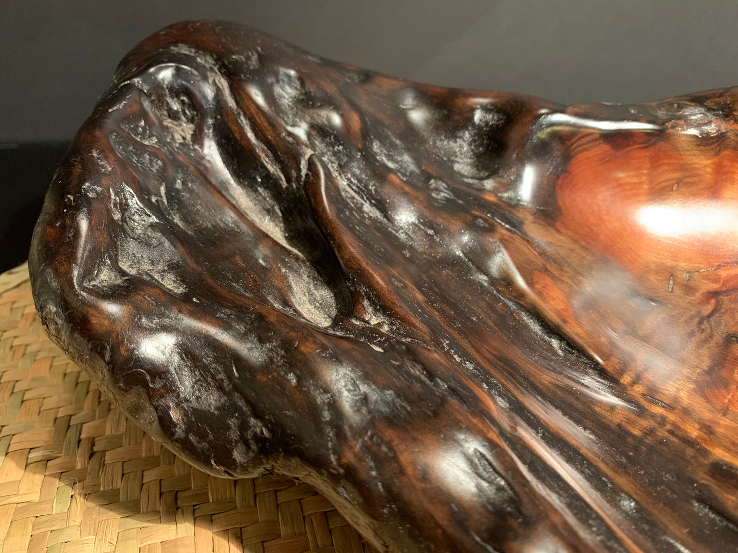 Wooden sculpture bowl left in natural shape with the centre worked to make the bowl.