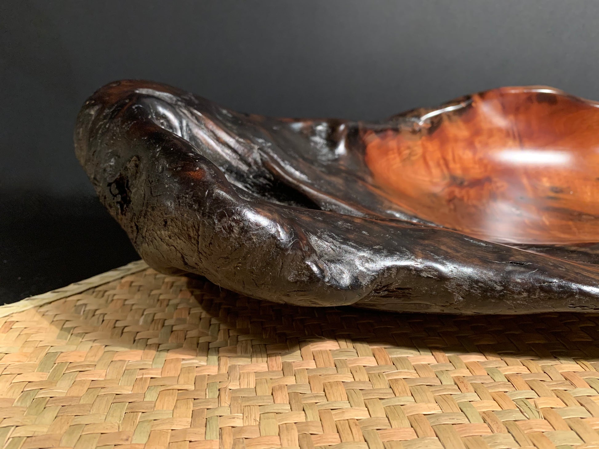 Weathered wood bowl with a natural shape, and revealing the worked wood inside.