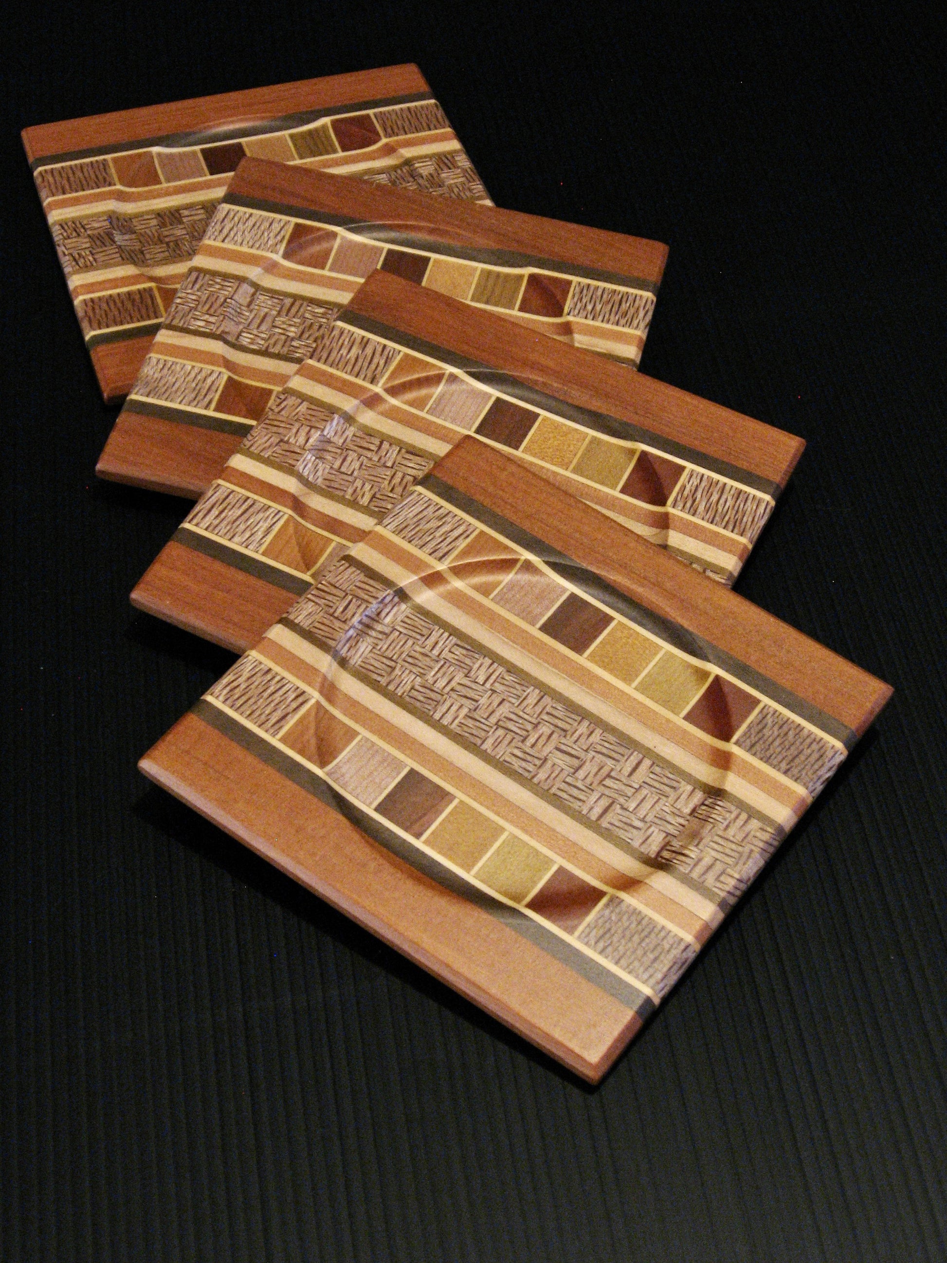 Set of Four Coasters showing many NZ Native Timbers with totara wood border by Timber Arts Silver Fern Gallery
