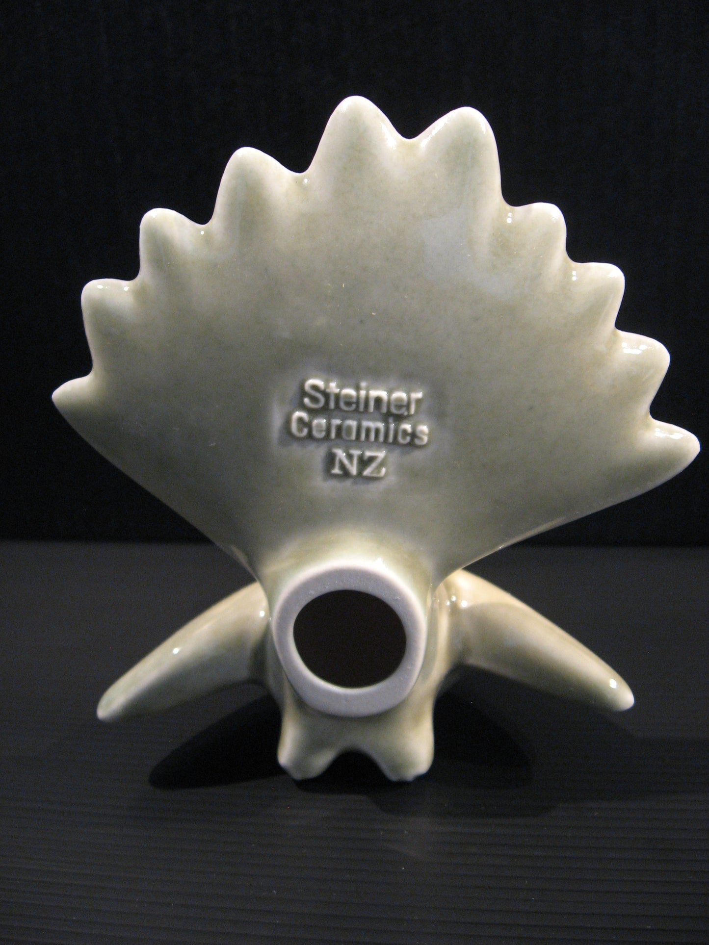 Back view of Ceramic Piwakawaka (Fantail) by Bob Steiner (celadon green) Silver Fern Gallery
