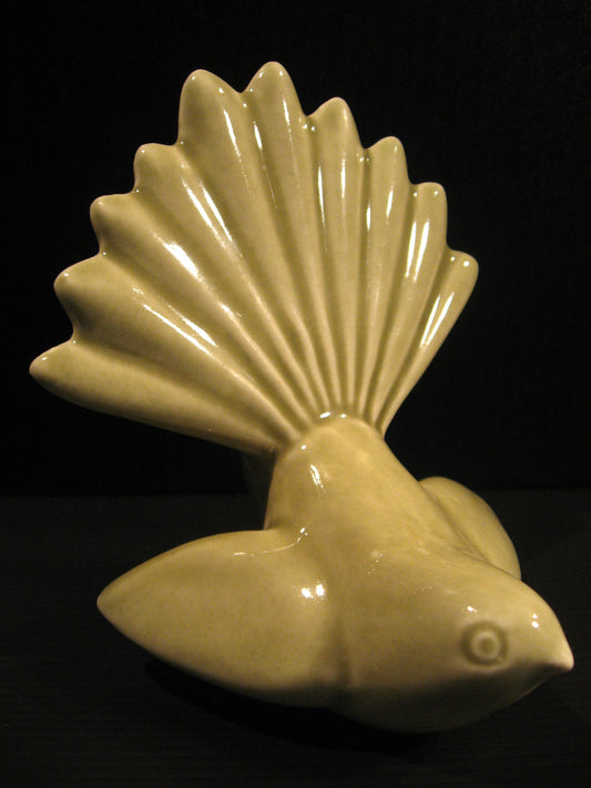 Side view of Ceramic Piwakawaka (Fantail) by Bob Steiner (celadon green) Silver Fern Gallery