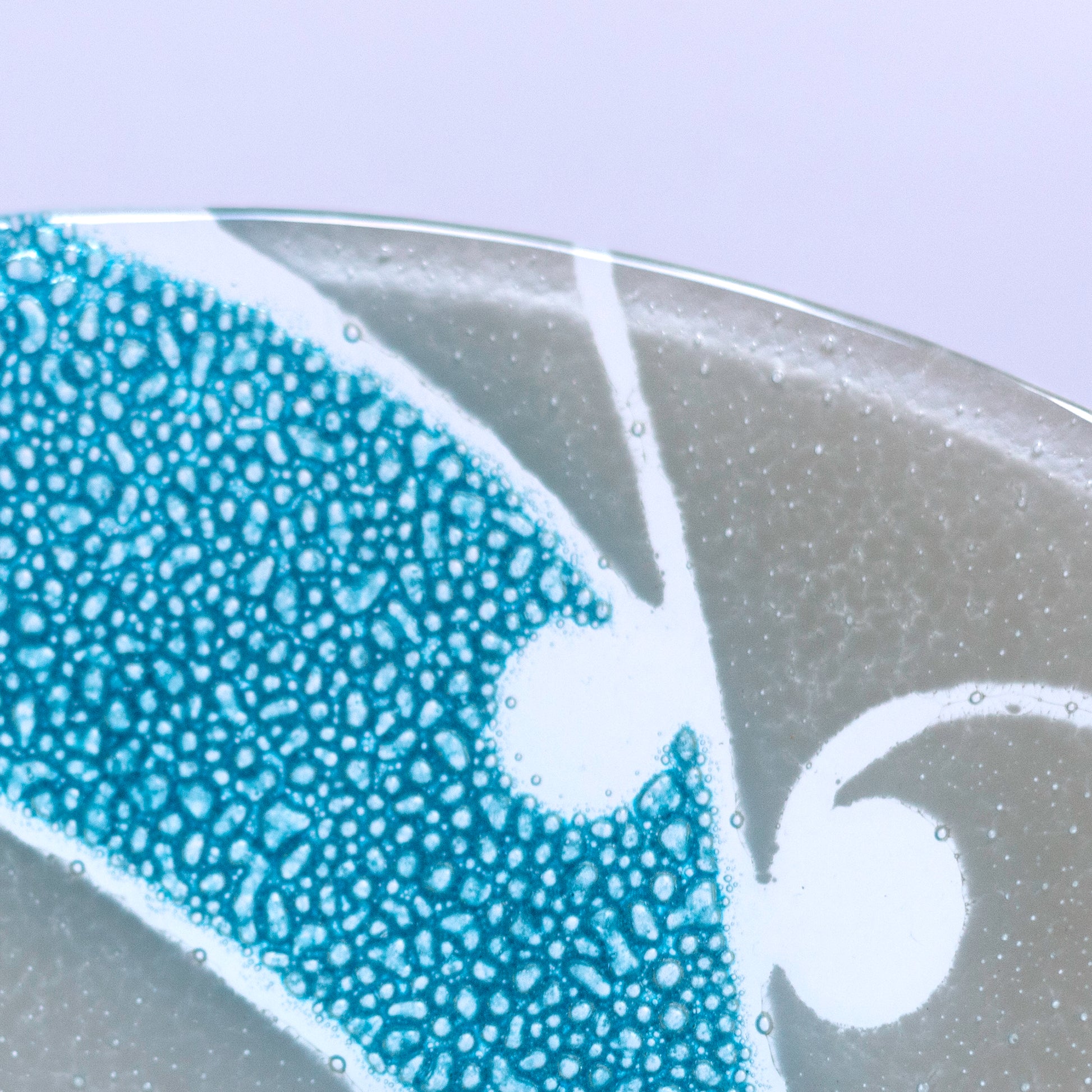 Detail of Fused Glass Bowl by Maori Boy - Kawakawa Design aqua and white Silver Fern Gallery