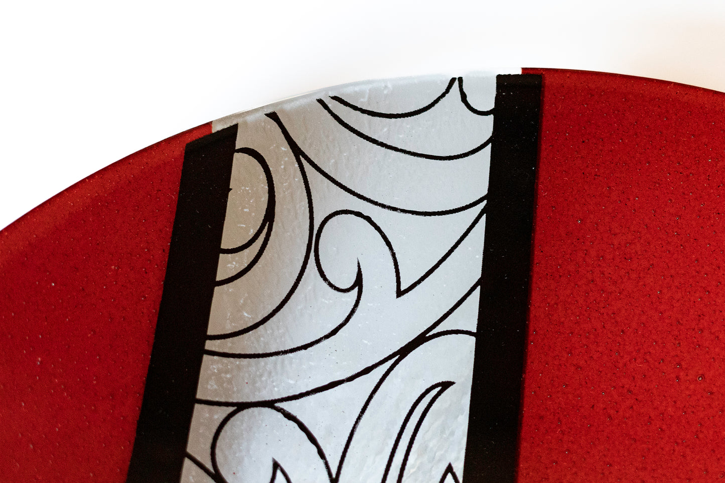 Detail of Fused Glass Bowl by Maori Boy Glassware Rongo Design (red) Silver Fern Gallery
