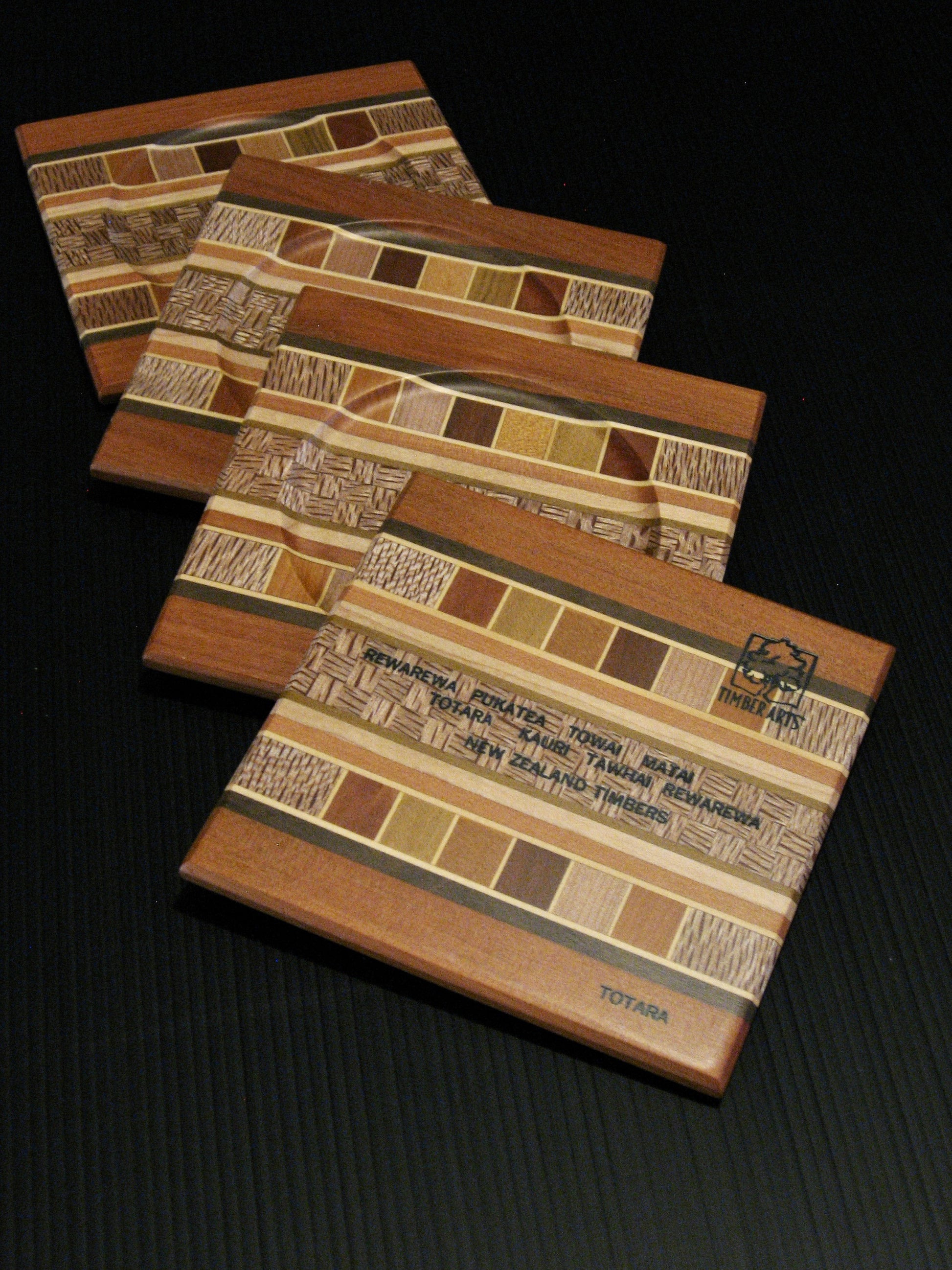 Back of Set of Four Coasters showing many NZ Native Timbers with totara wood border by Timber Arts Silver Fern Gallery