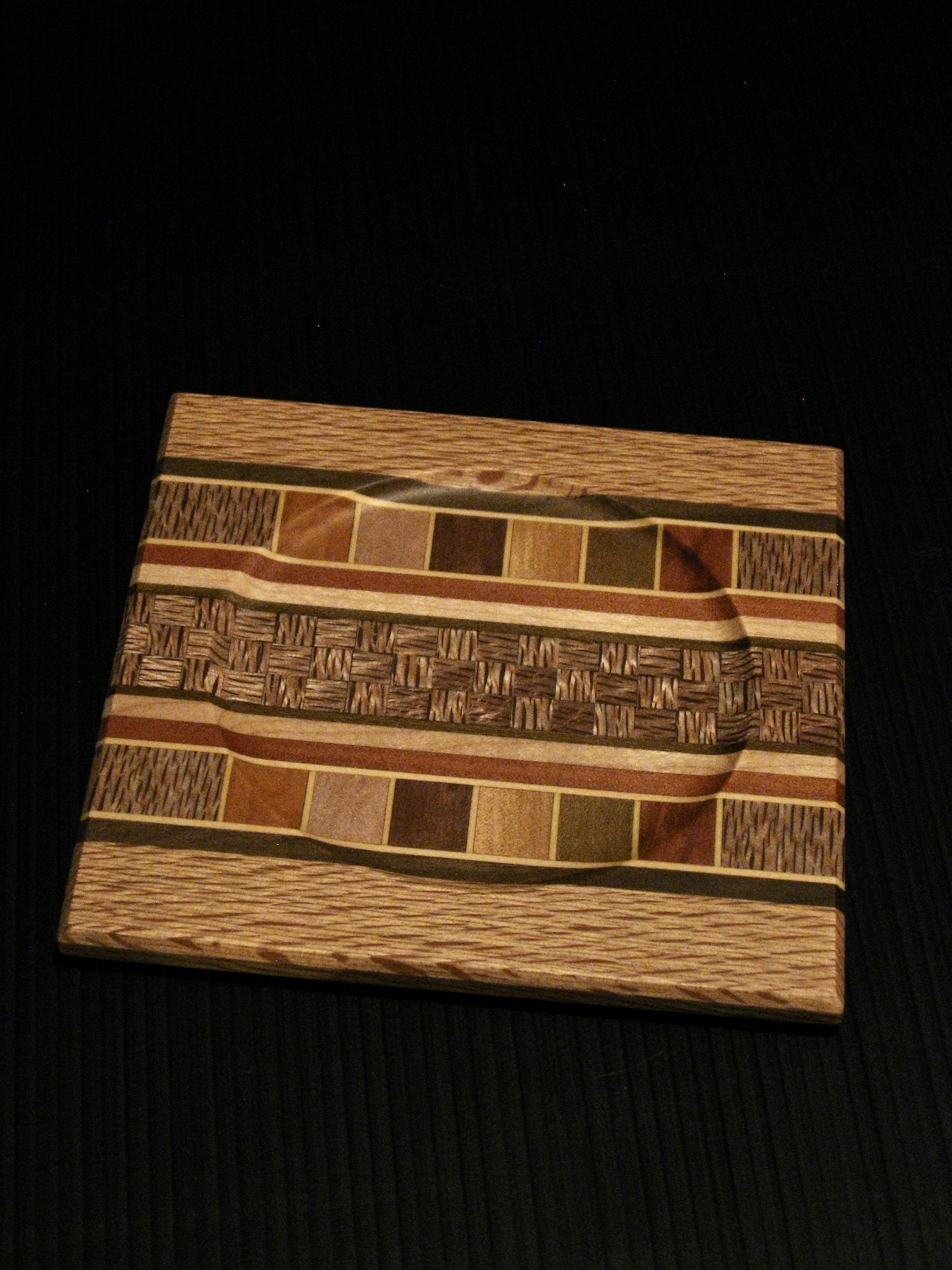 Coaster showing many NZ Native Timbers with rewarewa border by Timber Arts Silver Fern Gallery