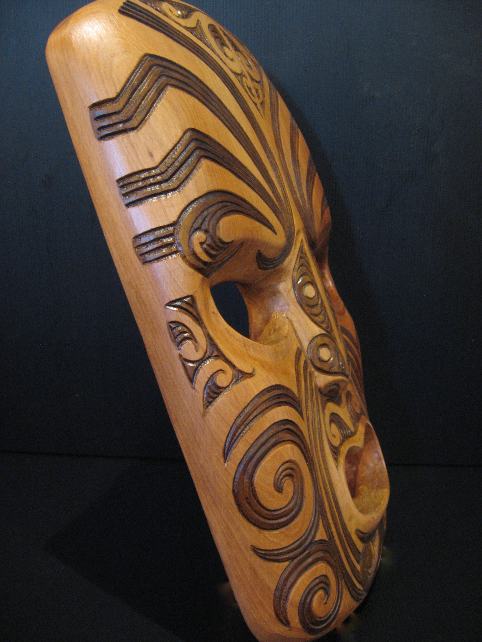 Side view of Hand Carved Maori Pailisade Mask by Jason Holder Silver Fern Gallery