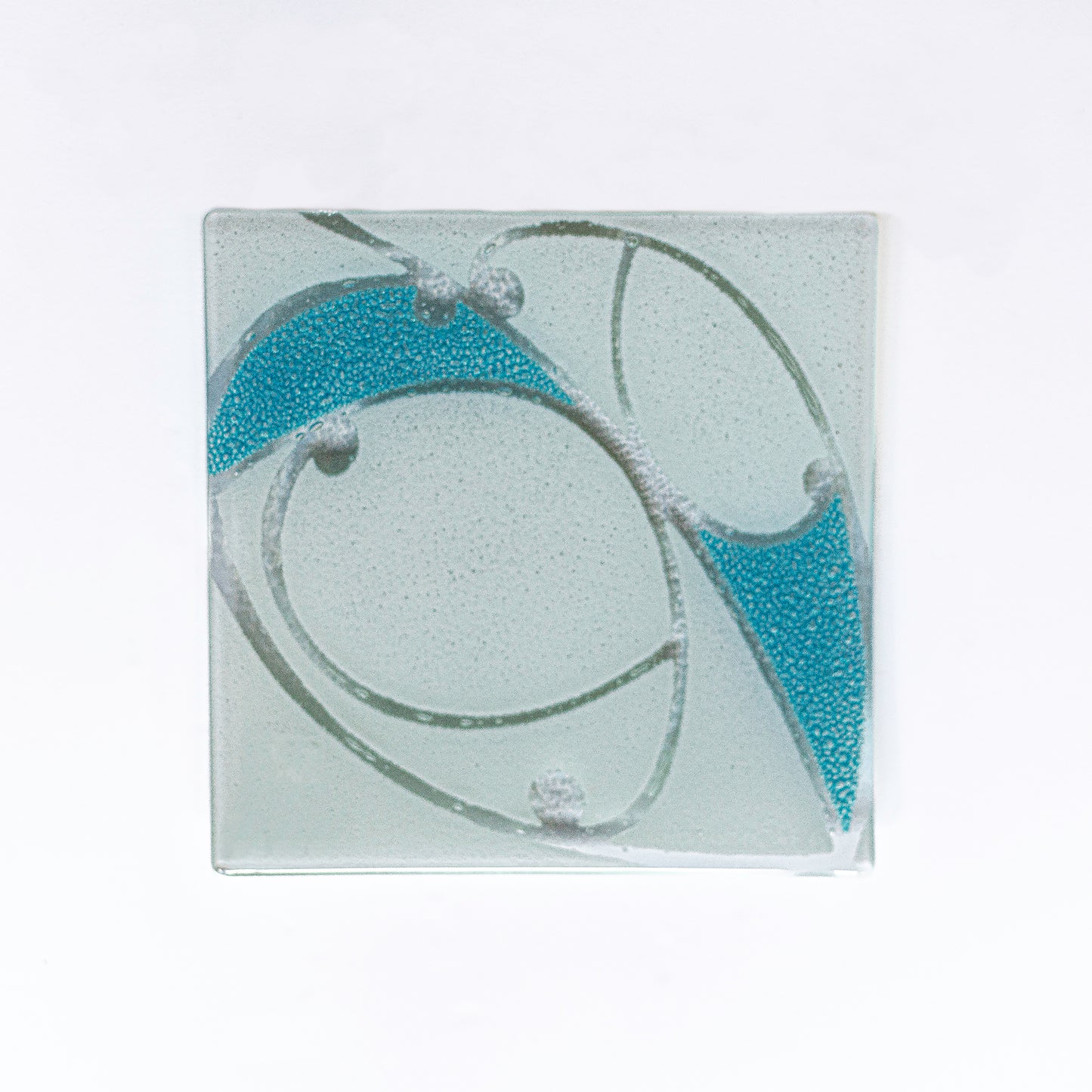 Detail of Fused Glass Coaster Set by Maori Boy Kawakawa Design Silver Fern Gallery