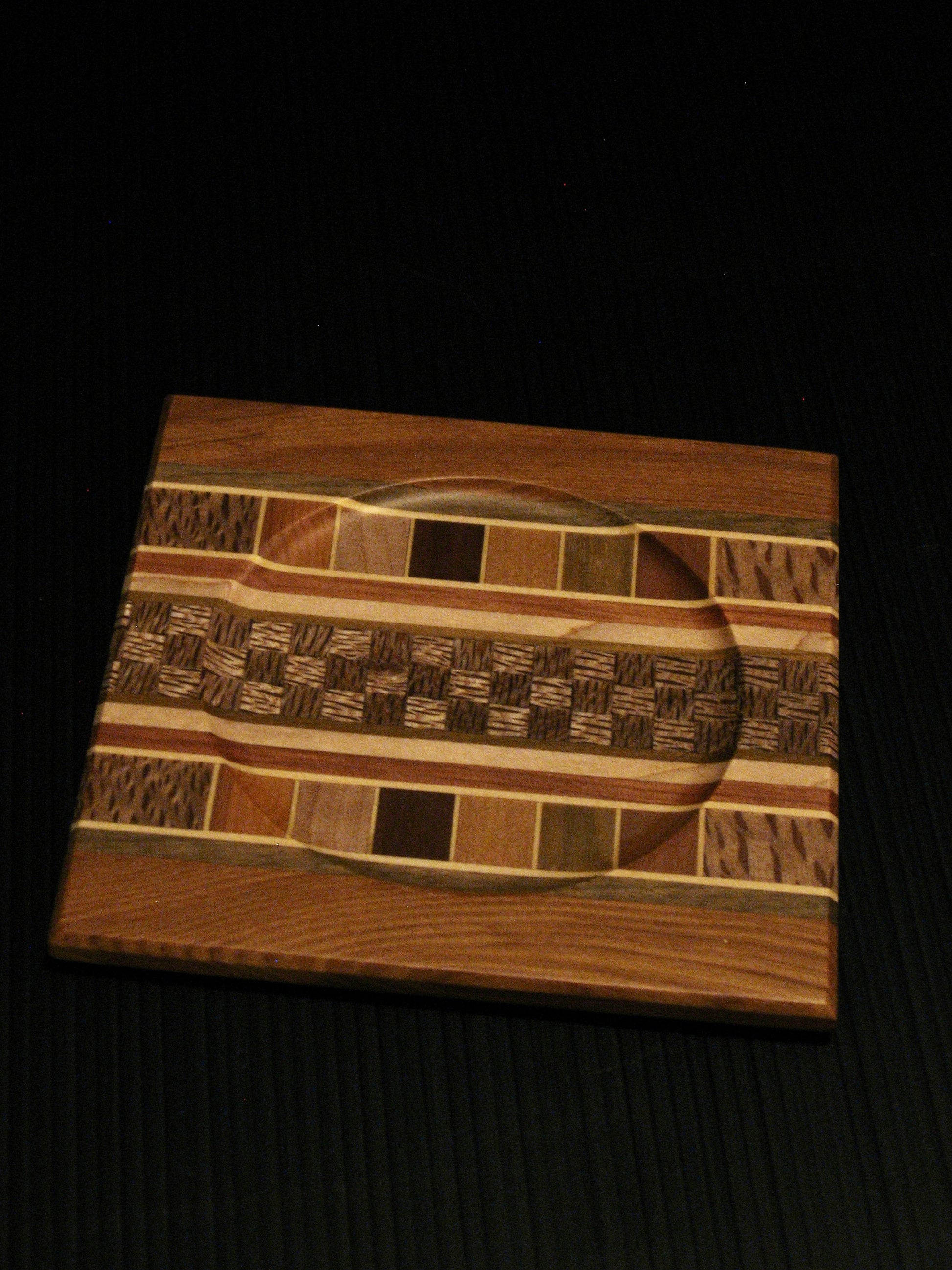 Coaster showing many NZ Native Timbers with rimu border by Timber Arts Silver Fern Gallery