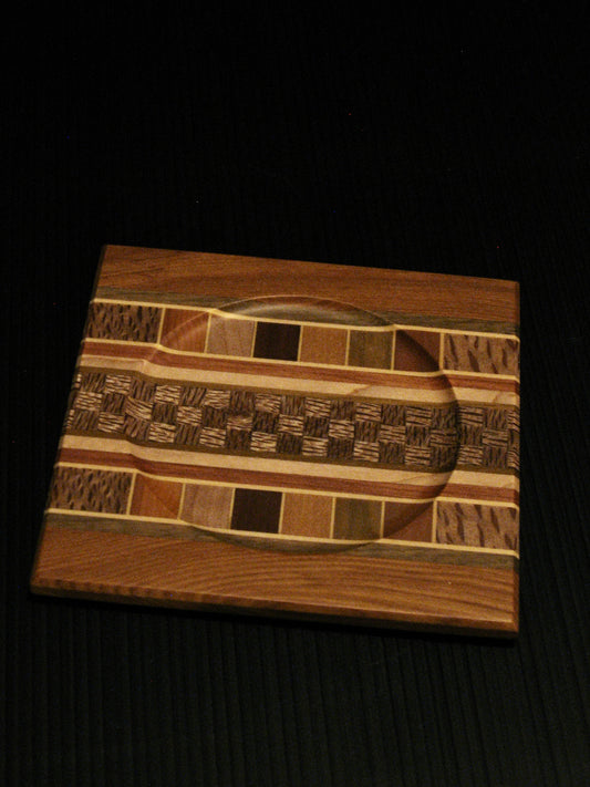 Coaster showing many NZ Native Timbers with rimu border by Timber Arts Silver Fern Gallery
