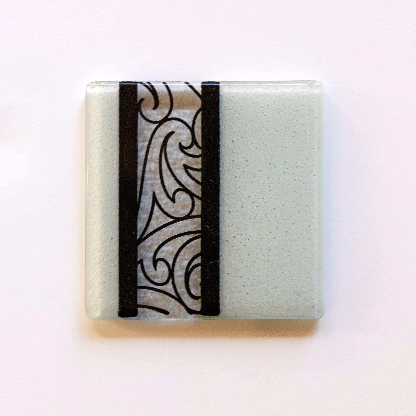 Detail of Fused Glass Coaster Set by Maori Boy Rongo Design White and Black Silver Fern Gallery